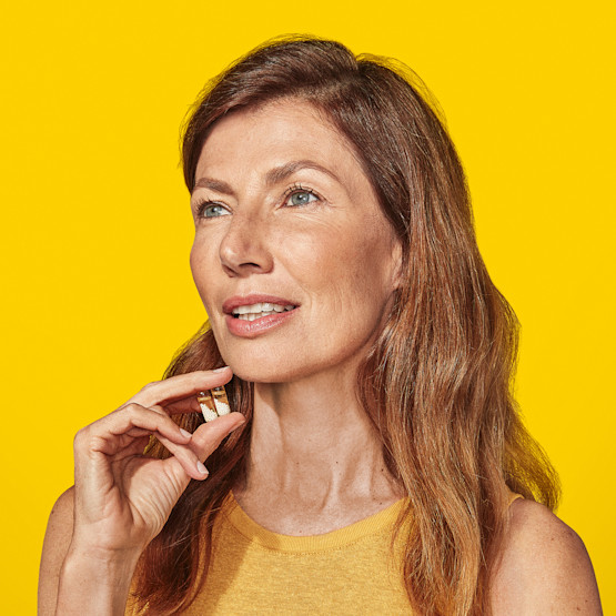 Woman holding Ritual's Multivitamin 50+