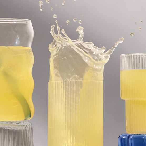 Three glasses of the mixed Fertility Support product with one splashing out of the rim of the glass.