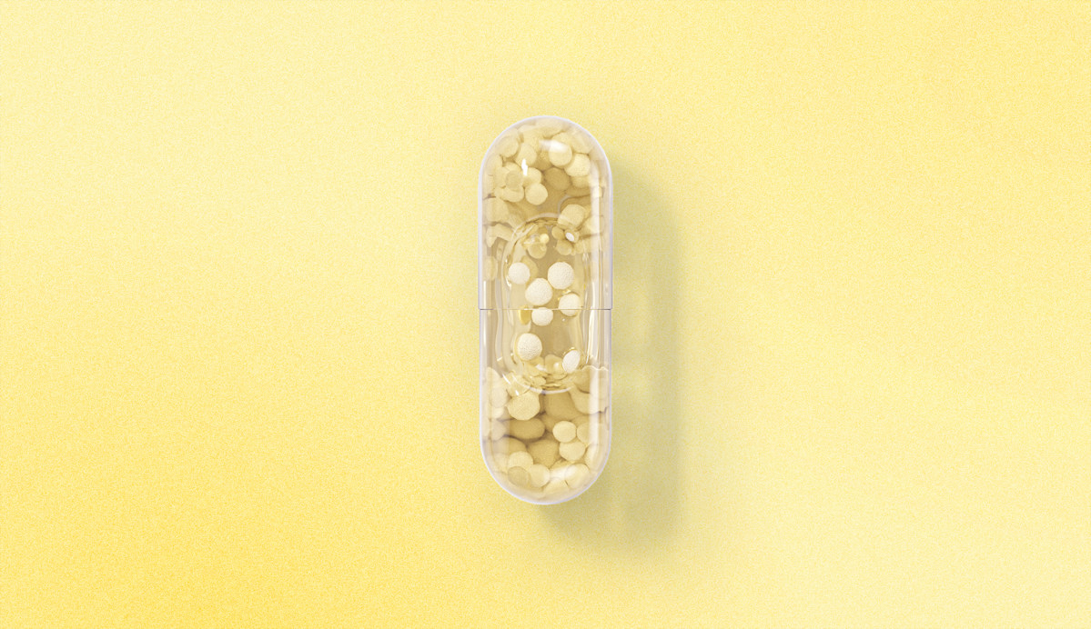 Ritual Essential for Women 18+ capsule on a yellow background