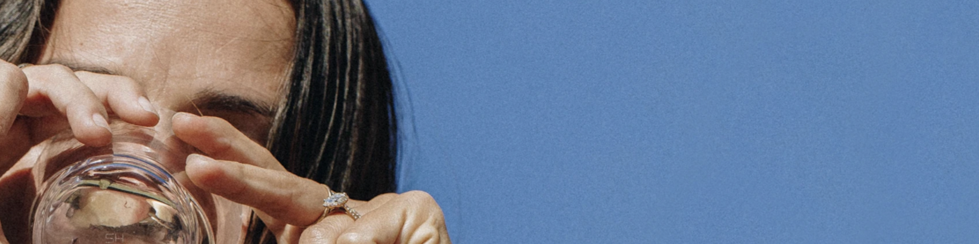 Woman drinking a glass of water.